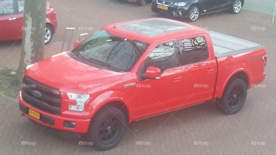 a big beautiful red car FORD