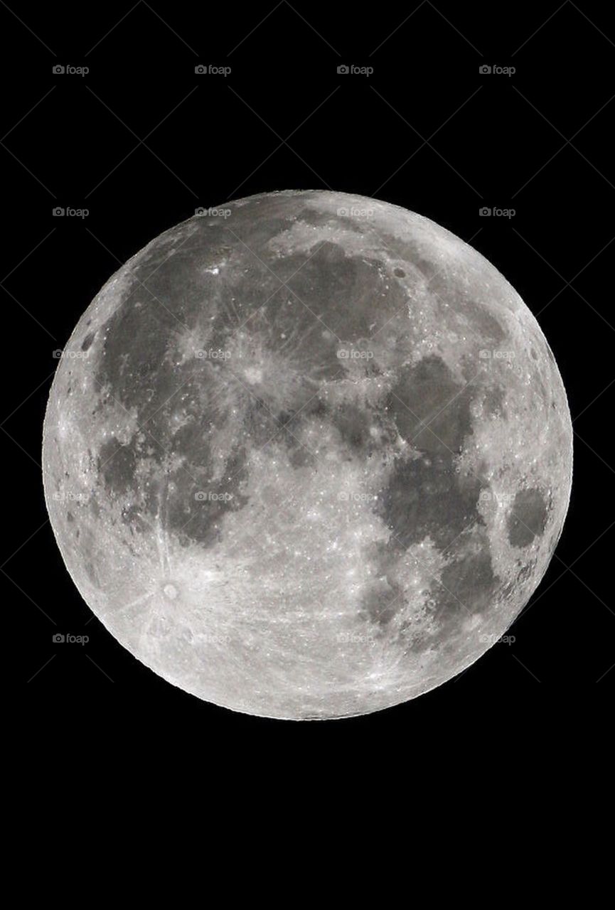 Photograph taken on a Canon T3 of the Full Moon in the night sky with visible craters