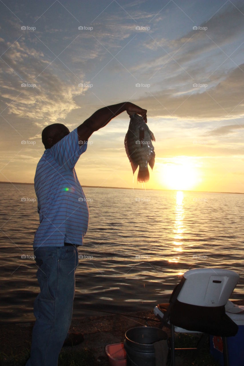 Fisherman and sunrise