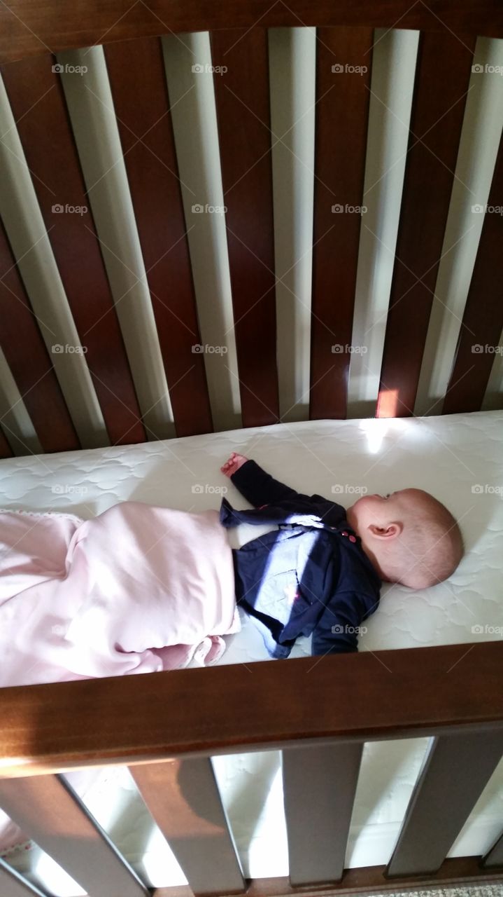 baby asleep in crib
