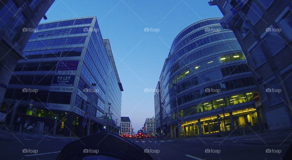 City streets at dawn as seen from riding a motorcycle