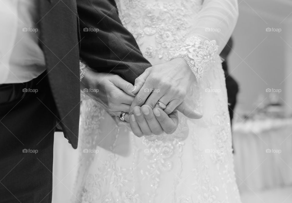 Couples hand with wedding rings