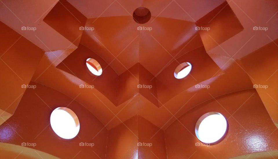 Bright Orange Sculpture With Holes