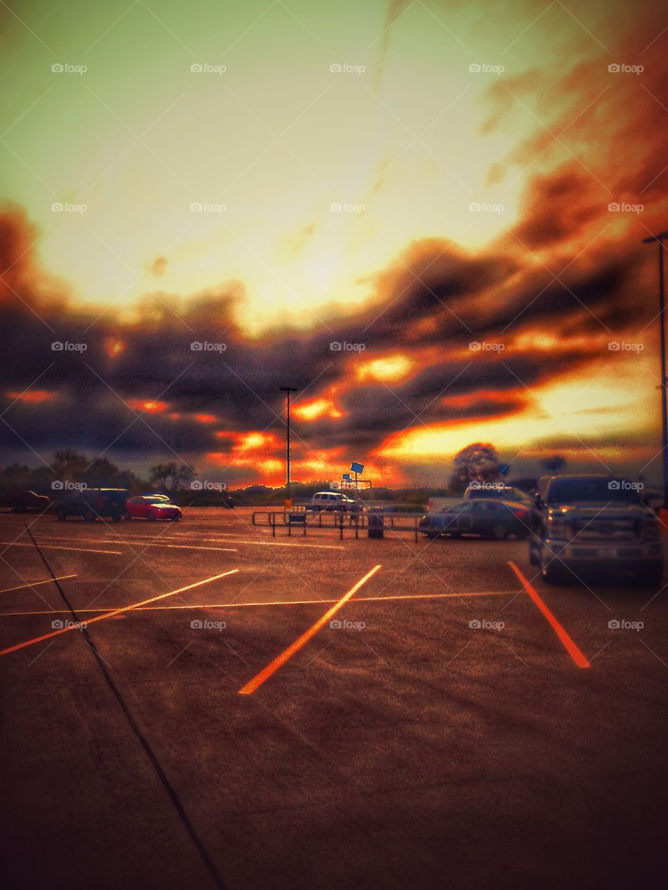 Sun And Clouds Over Parking Lot