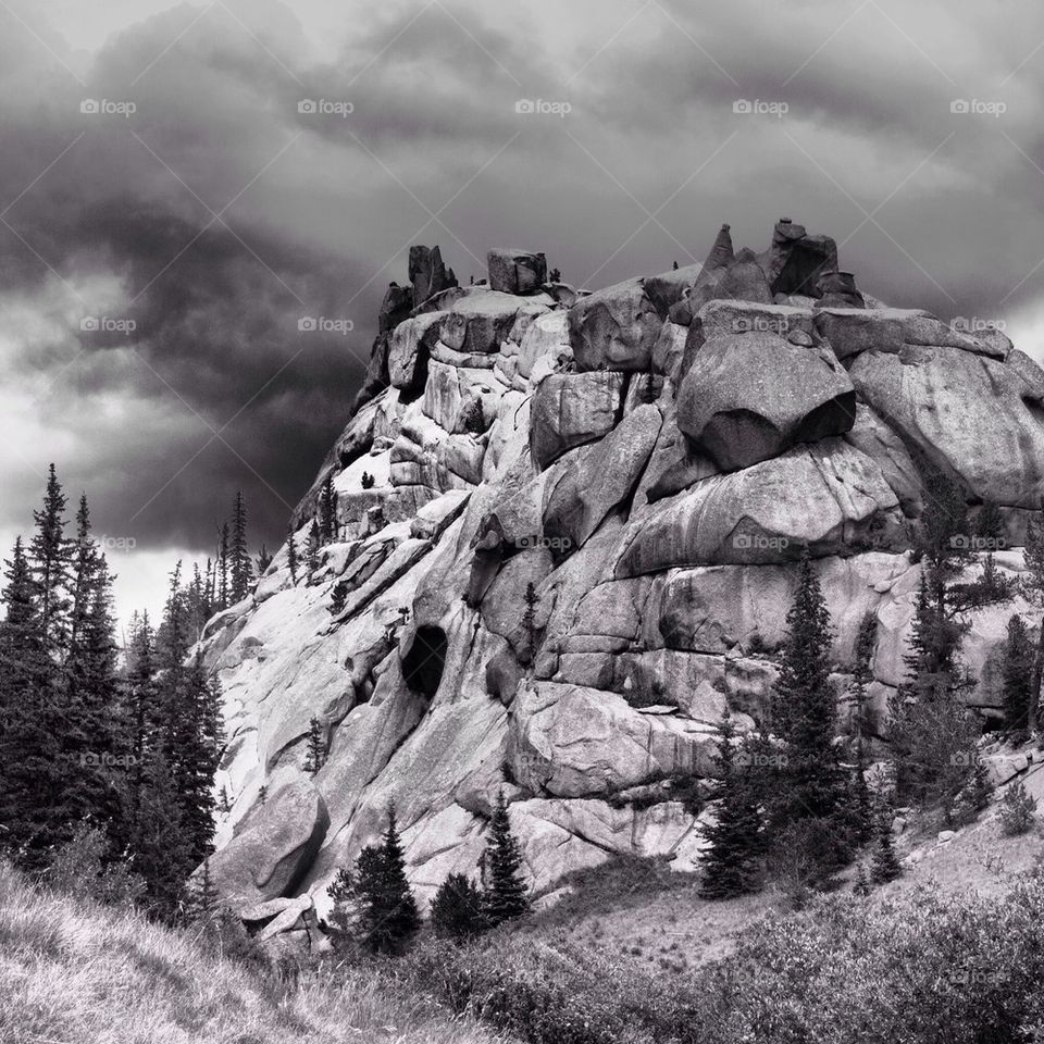 View of stormy clouds over the rocky mountain