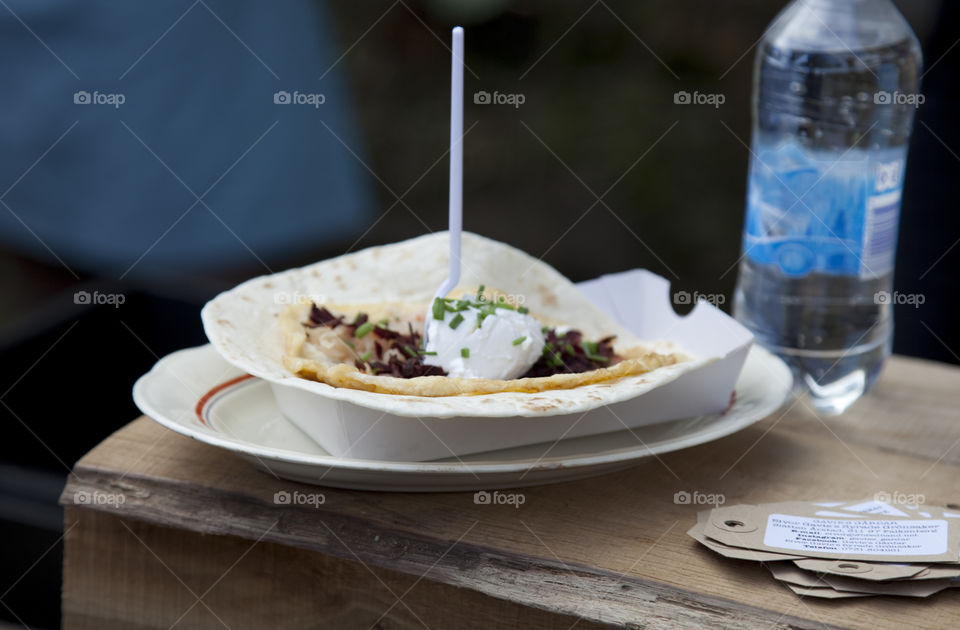 Streetfood, tortilla bread, meat, sourcream,chives