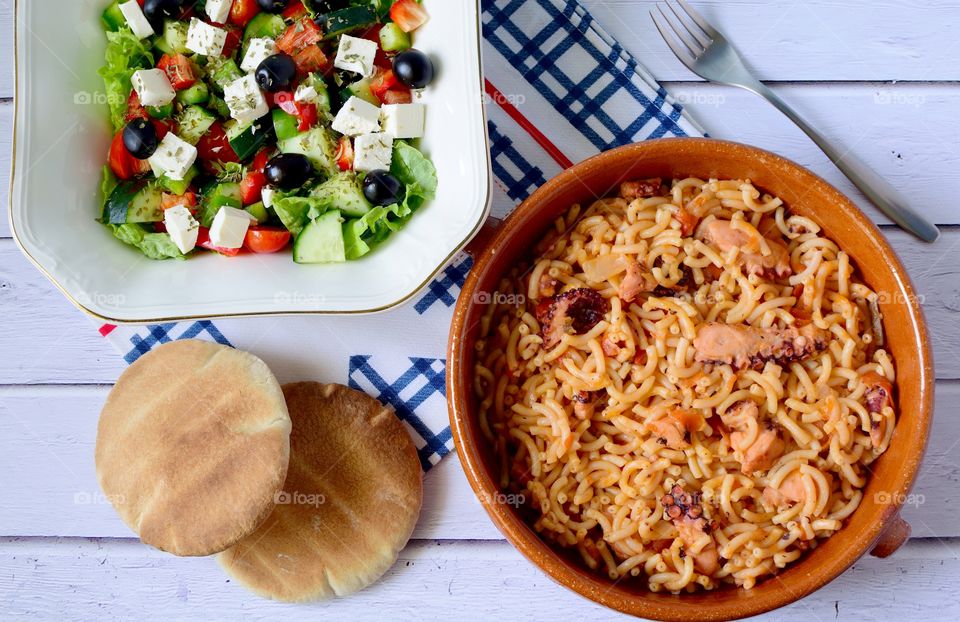 High angle view of greek food and greek salad