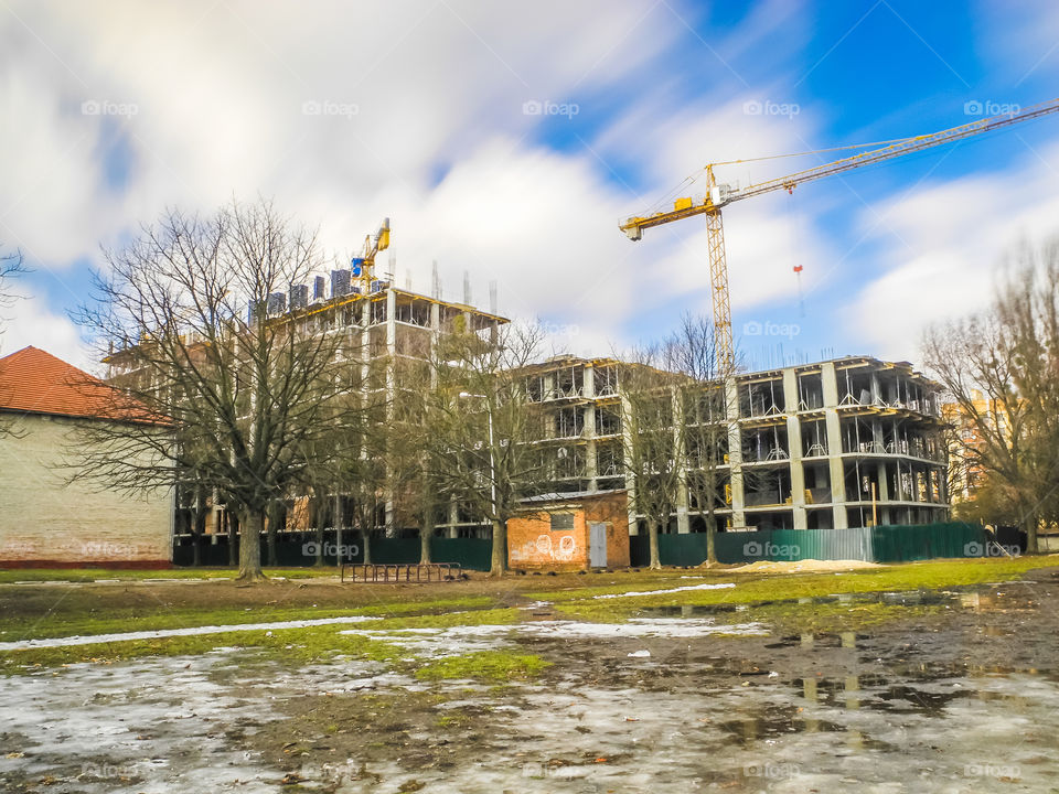 building process with crane on long exposure