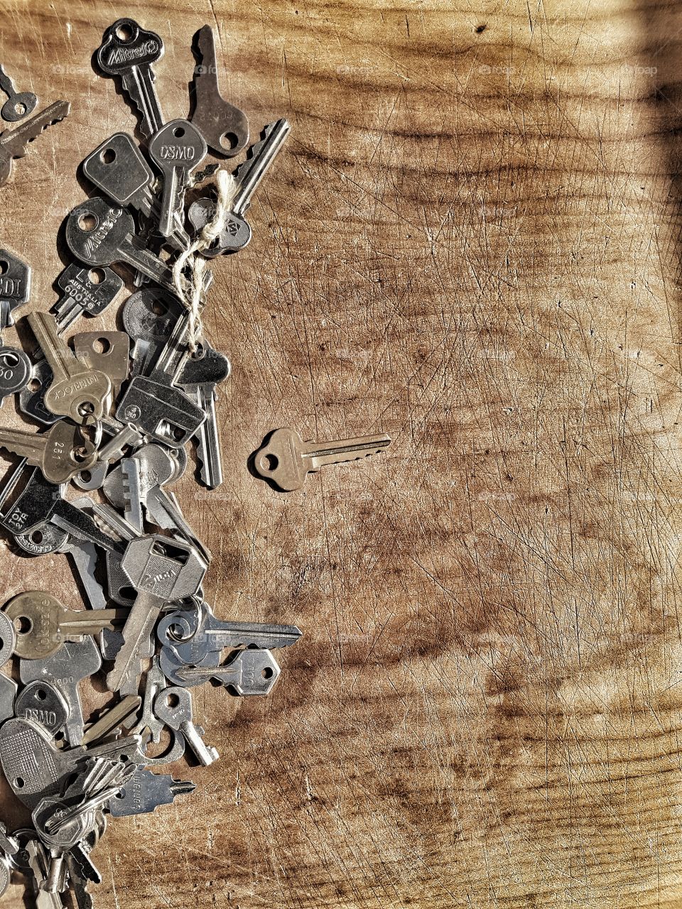 old Keys on rustic wooden background
