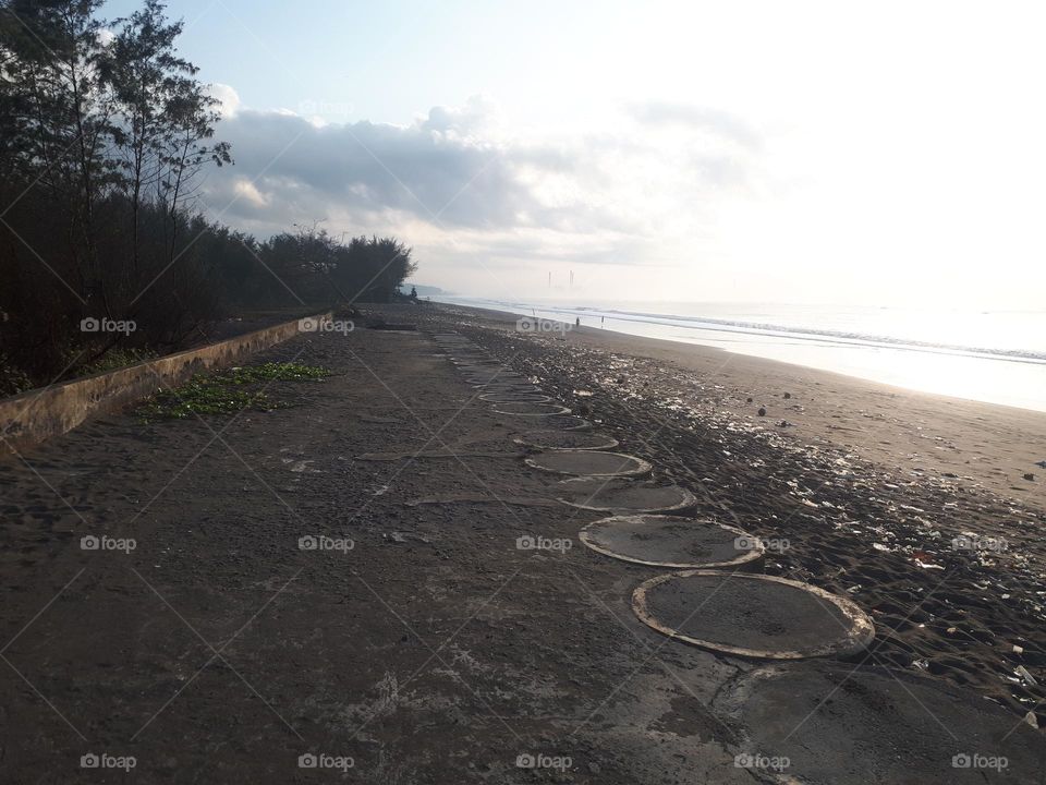 Stunning natural scenery with a wide beach and calm waves is perfect for surfing or a summer holiday