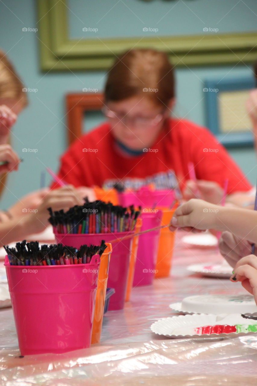 Blurry pic of young girl painting