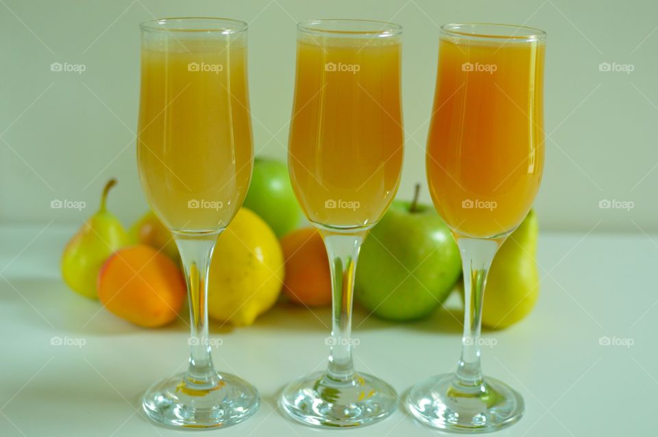 three glasses of homemade fruit juice