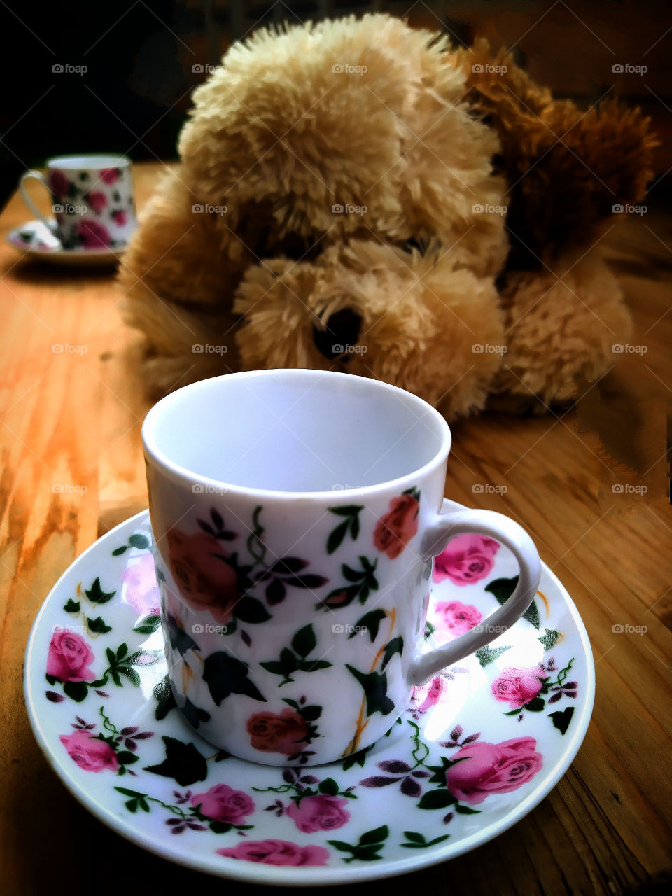 Multicolored porcelain cup and plush dog