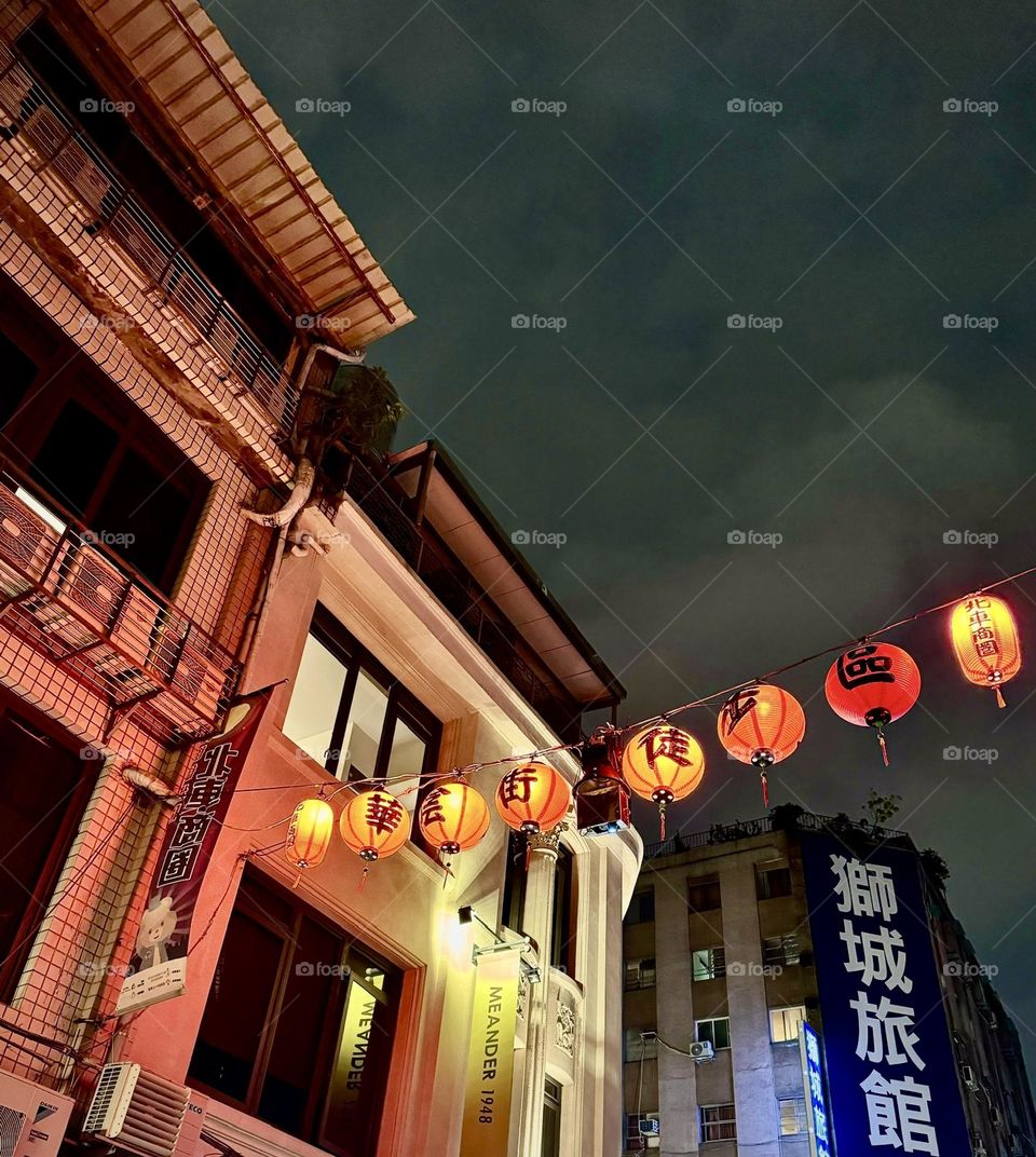 Street with lanterns hanging at night