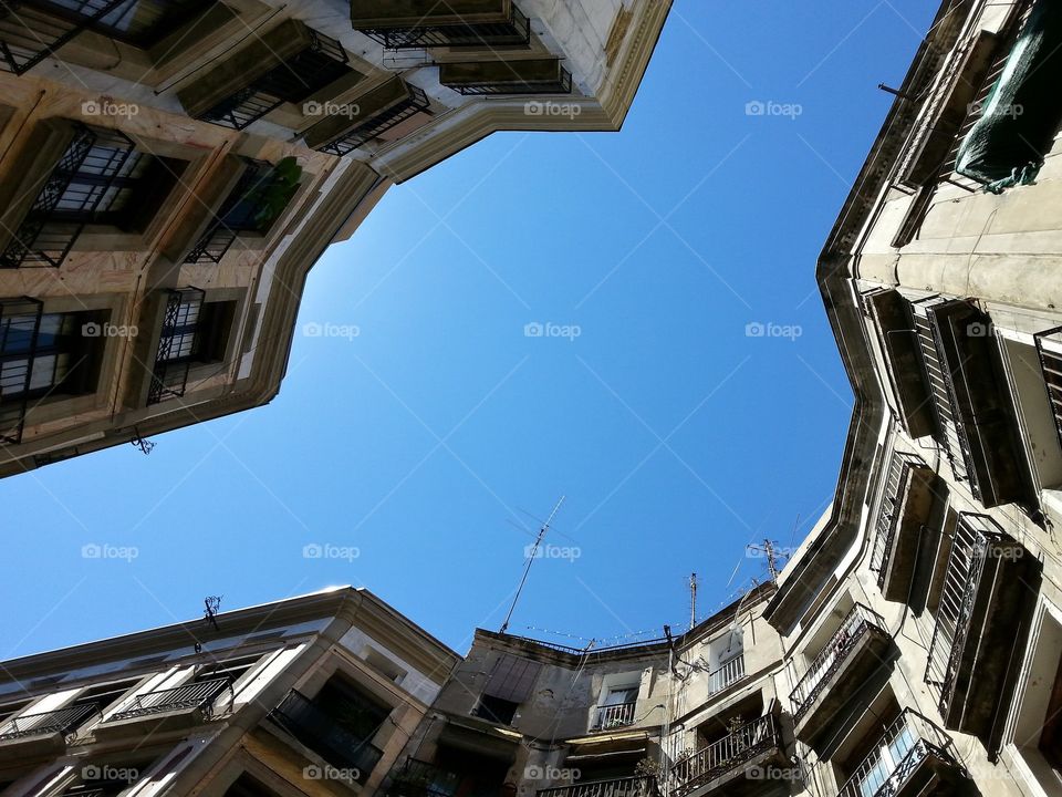 Barcelona sky through buildings