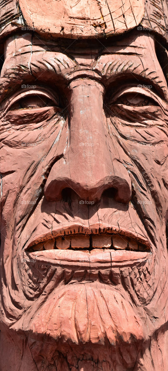Close up of carved wooden face