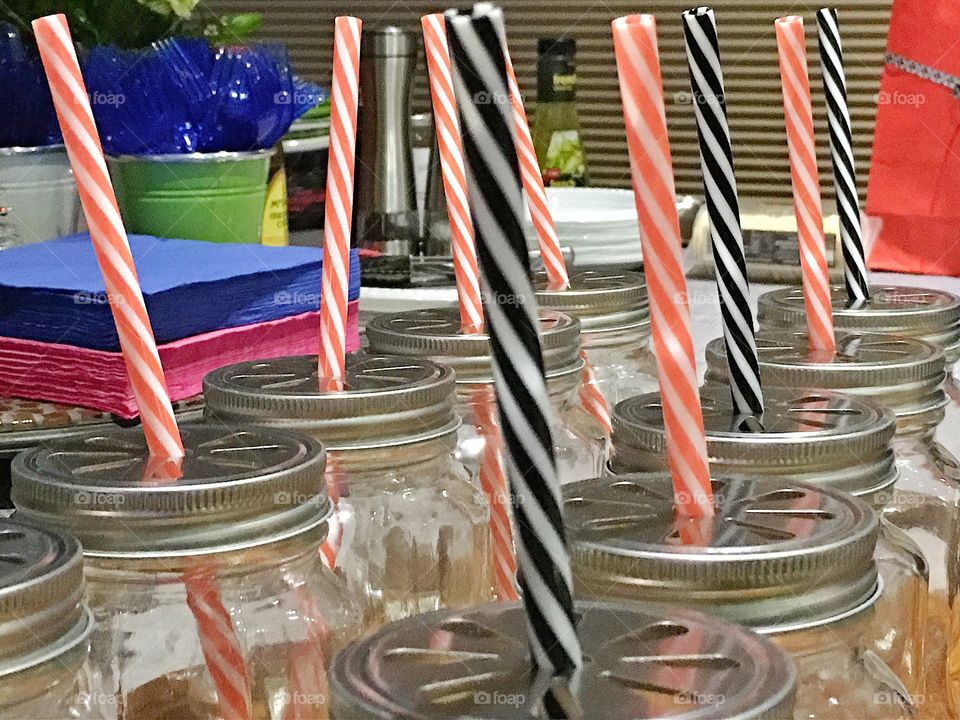 Bar service, mason jar mugs and straws for tropical drinks