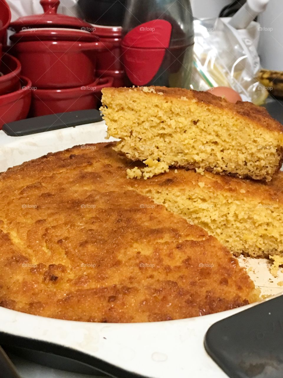 Homemade cornbread in round pan wedge slice piece cut