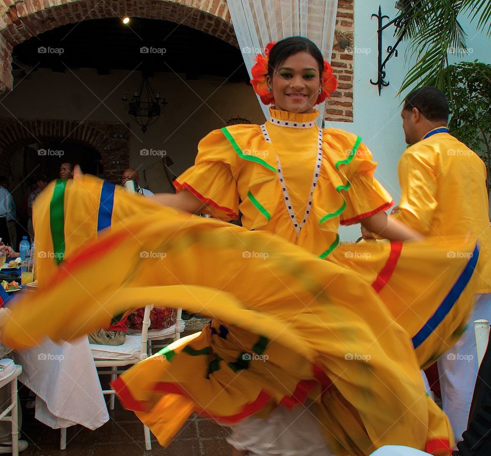 Yellow Dancer. Beautiful girl dancing in yellow dress