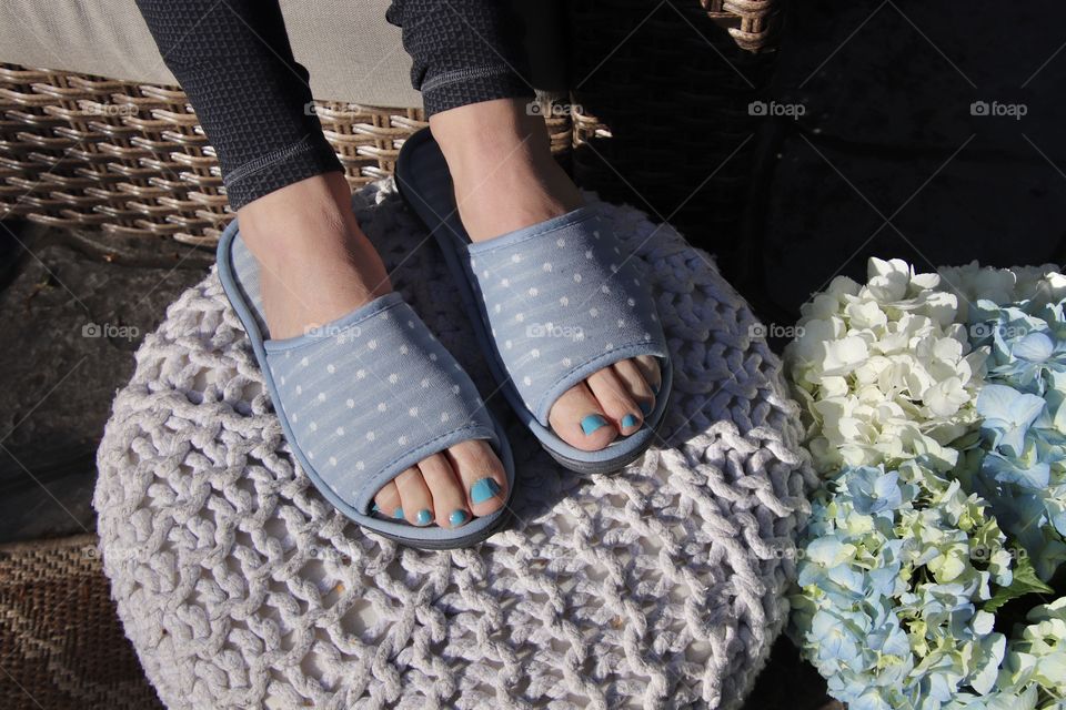Woman wearing Isotoner slippers