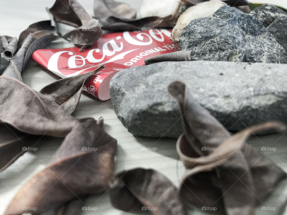 Coke dry leaves and stones 