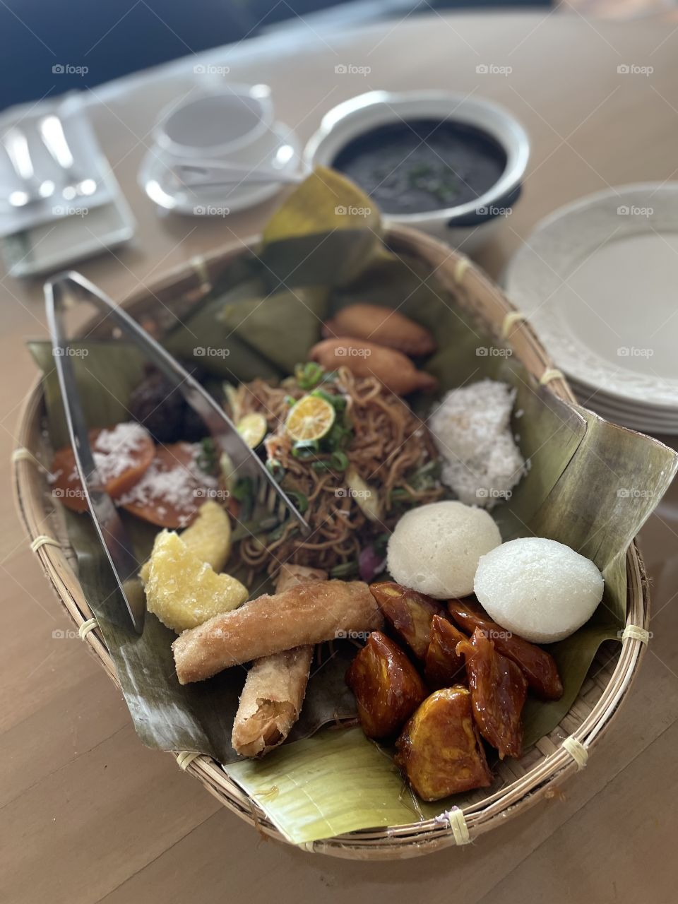 Filipino native foods in a winnowing basket (bowl made of bamboo)