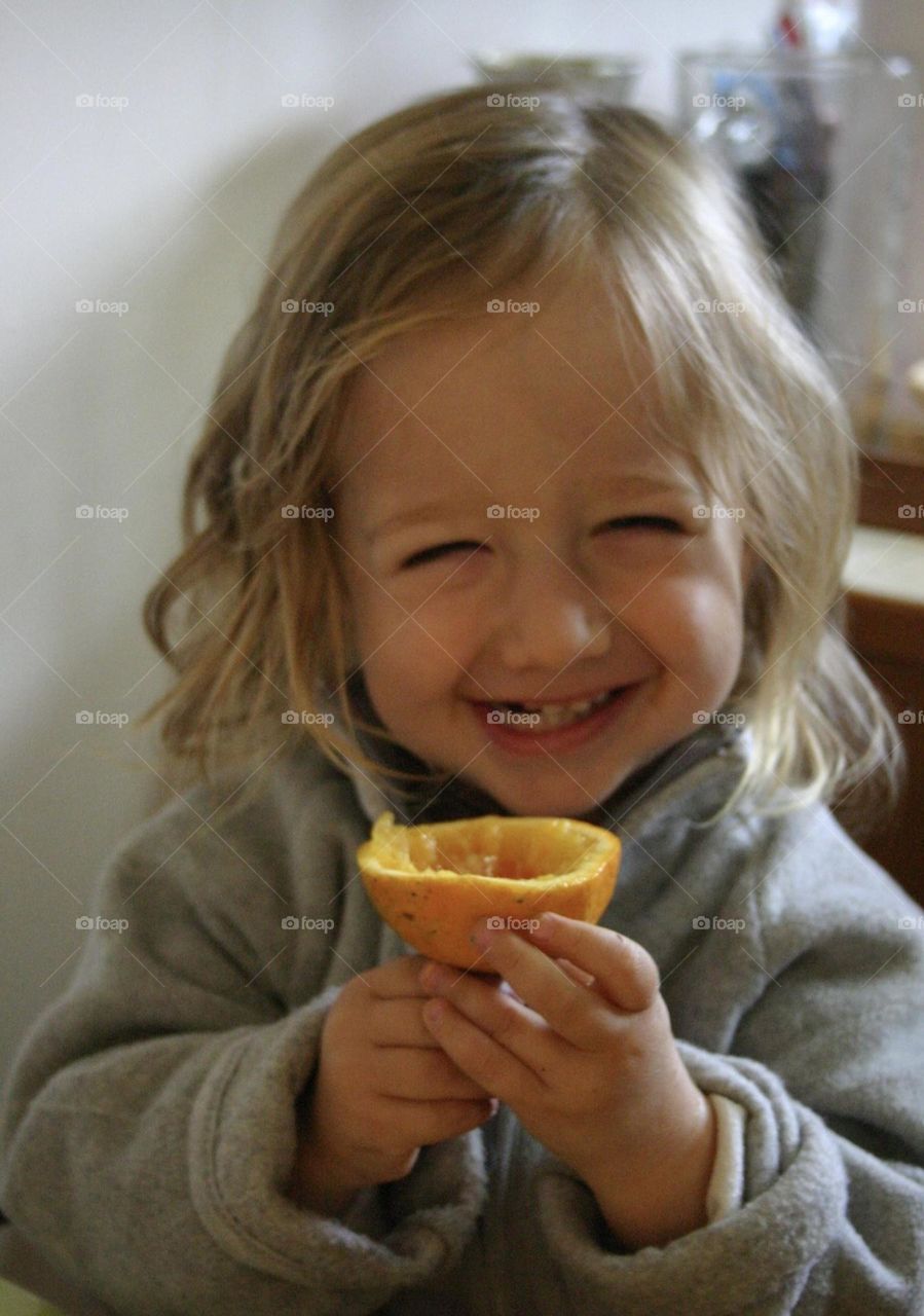 Happiness with an orange 