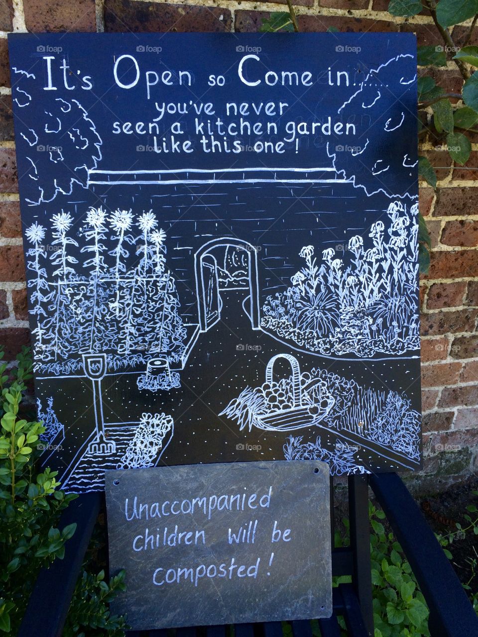 Entrance sign to Painshill walled kitchen garden.