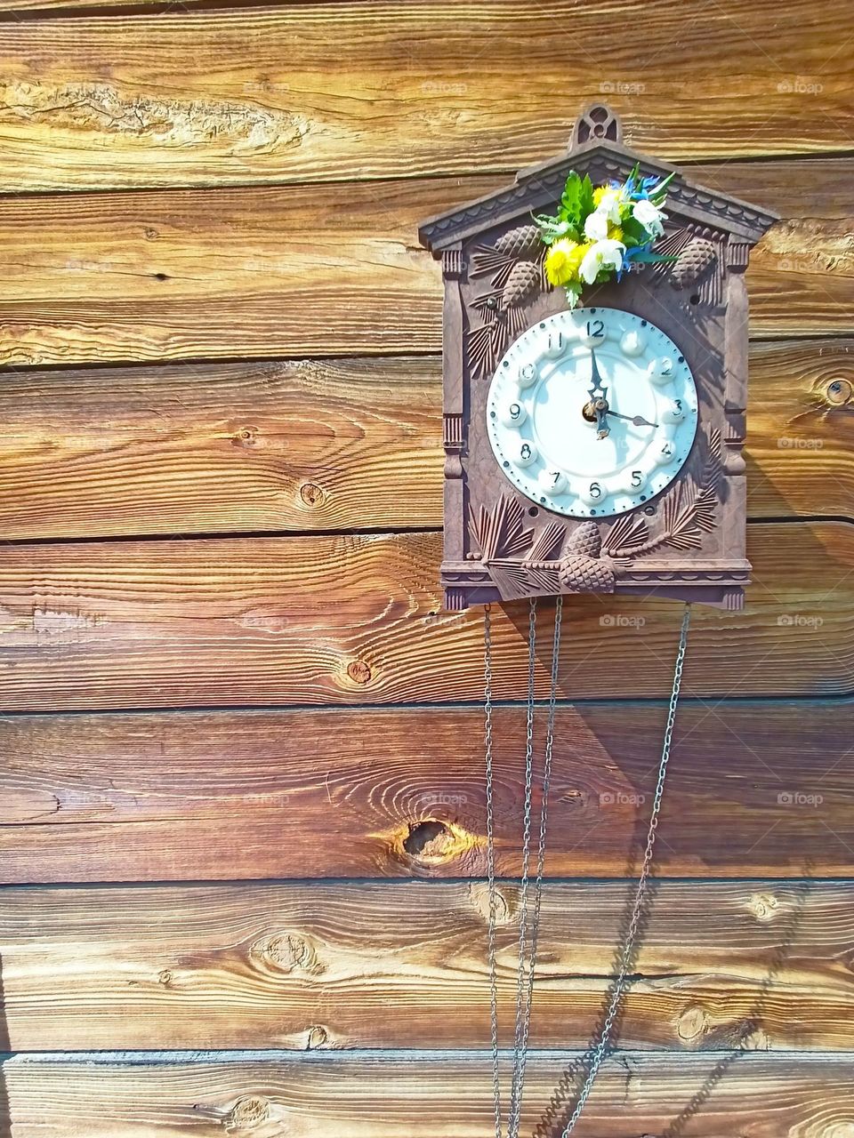 wall clock, broken clock, bouquet, spring, may, clock flowers, spring motifs, spring mood, wooden boards, house facade, flowers, chains