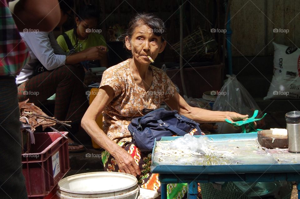 Saleswoman at market in Yangon