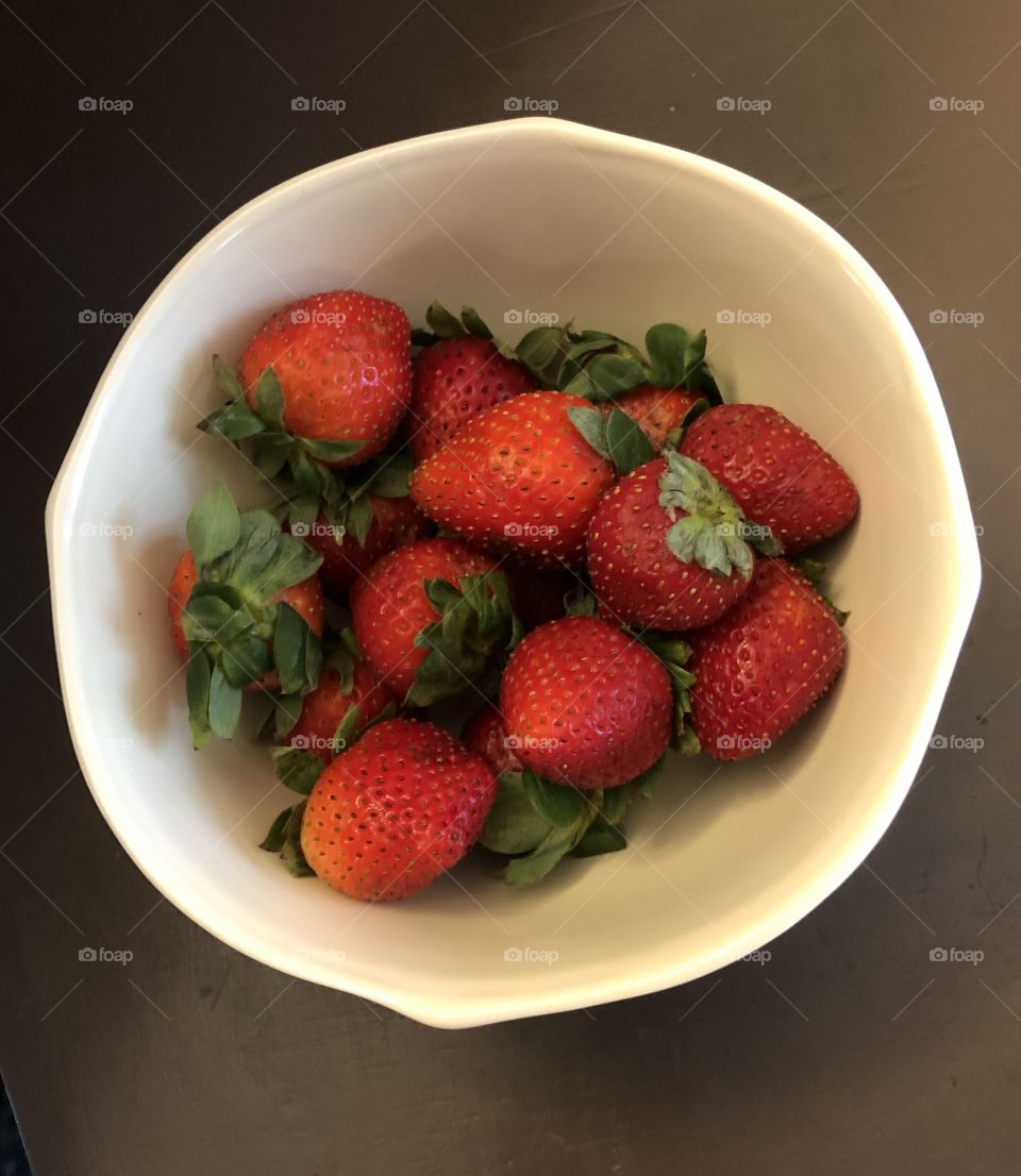 White bowl with fresh strawberries 