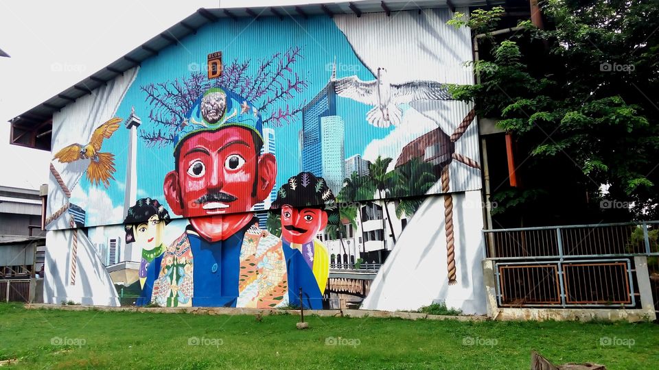 picture of Ondel-ondel Betawi on the wall