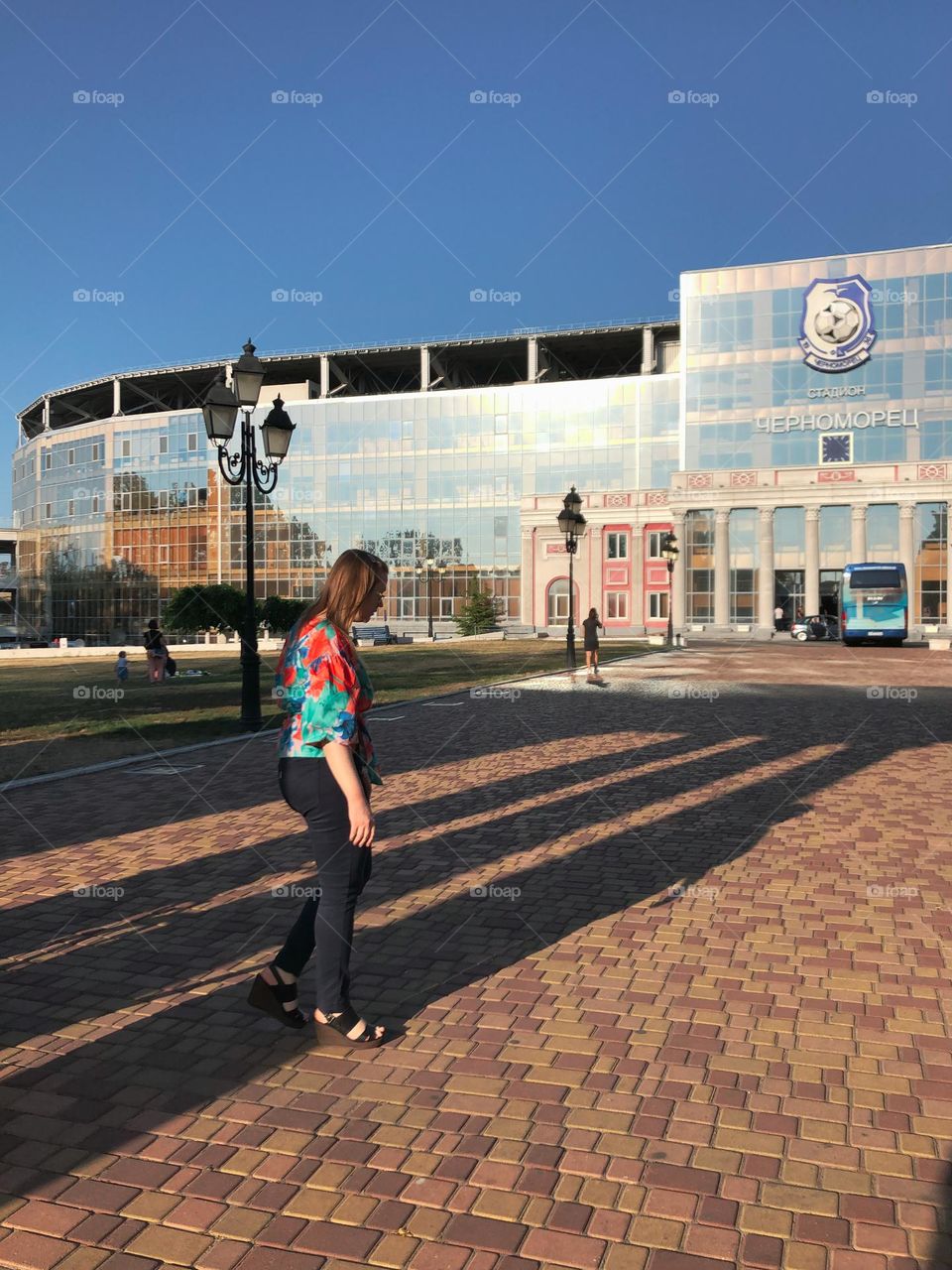 Walking near the glass stadium 