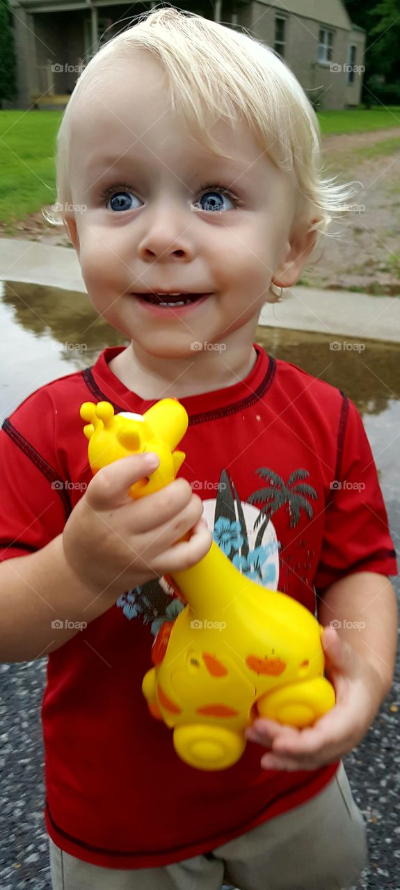 Close-up of cute boy holding toy