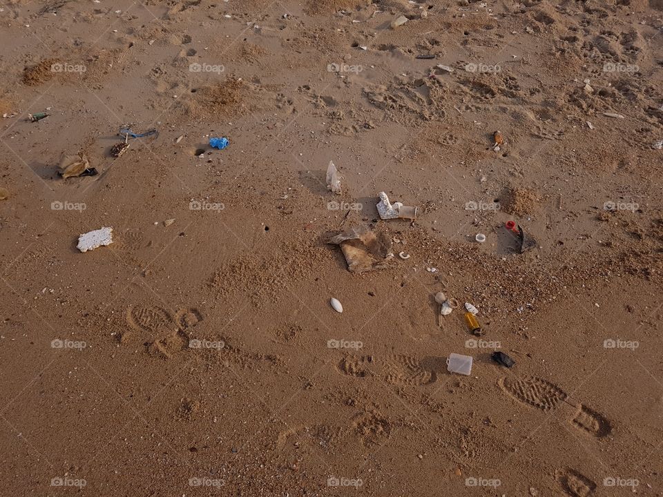 trash on a sandy beach