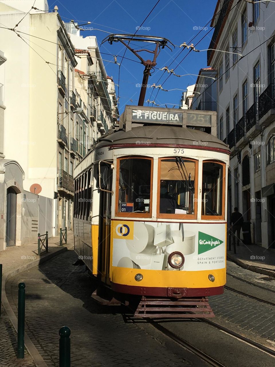 Traditional tramway in Lisboa street with morning sun