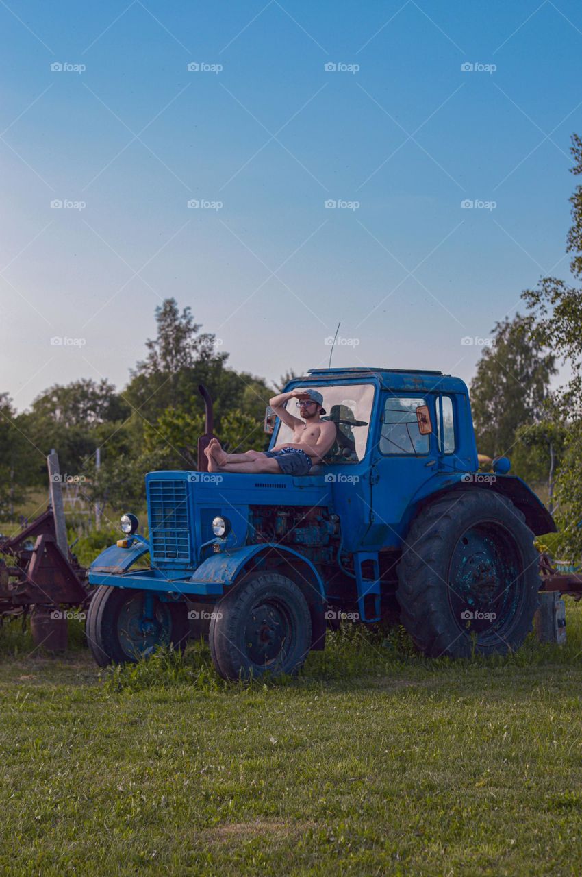 Relaxing on tractor after everything is done.