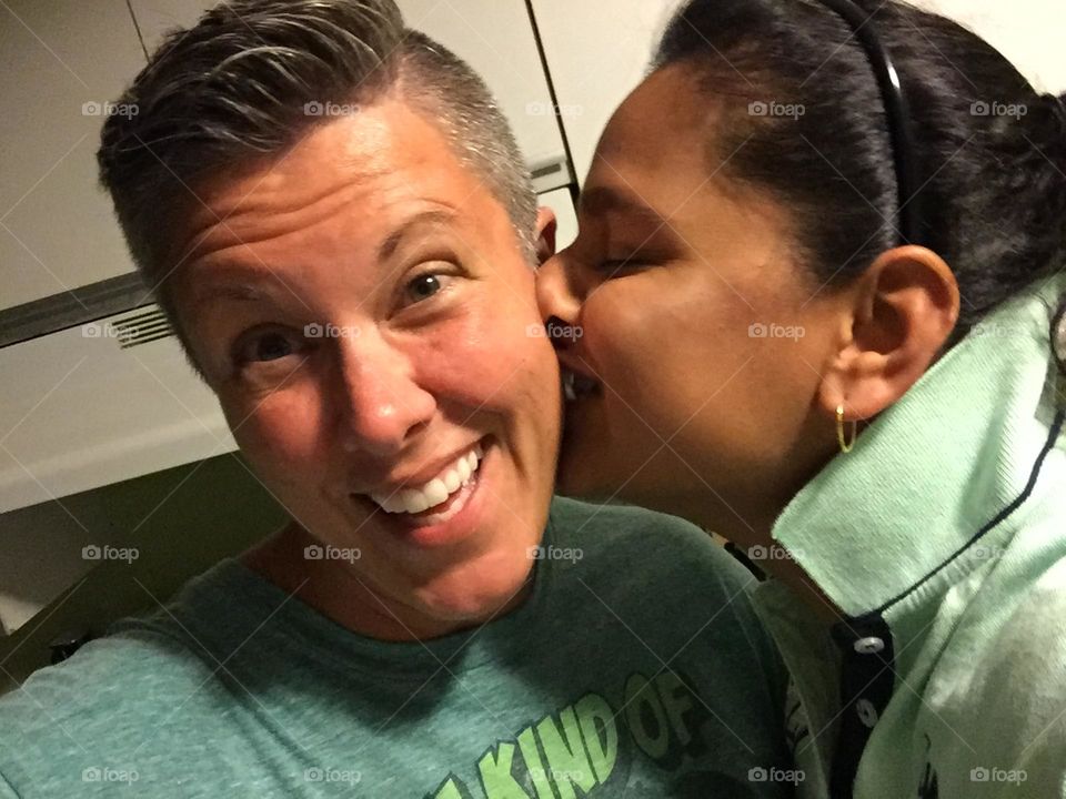 Girl kisses girl on cheek, love at first kiss, lesbian relationship, loving kiss on the cheek, kisses on the cheek, kisses from the misses