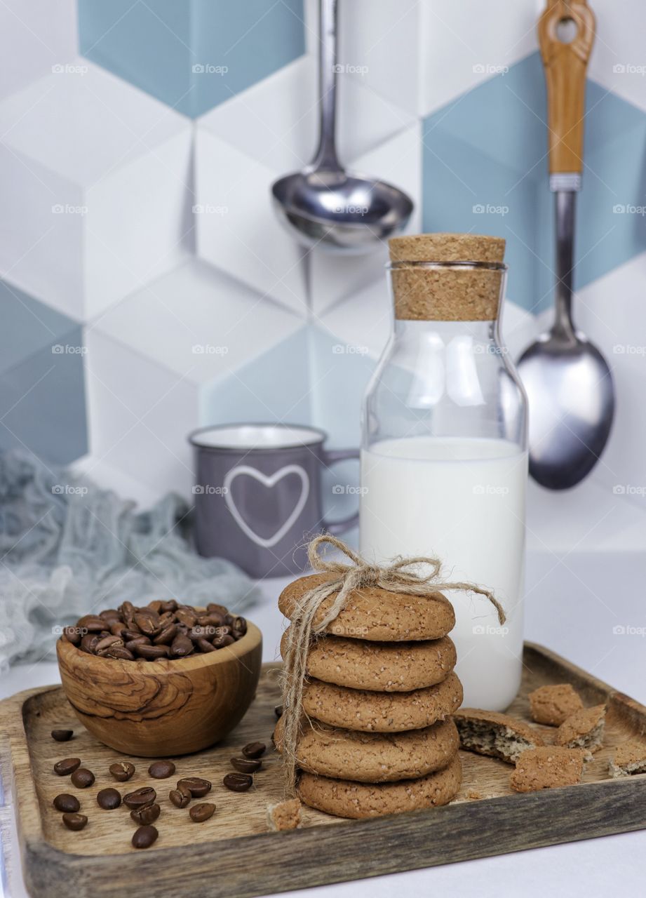 Oatmeal cookies and a bottle of milk