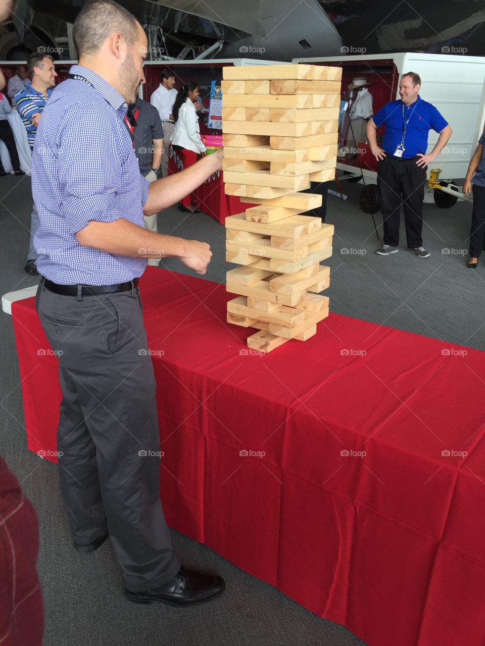Playing Jenga at office party 