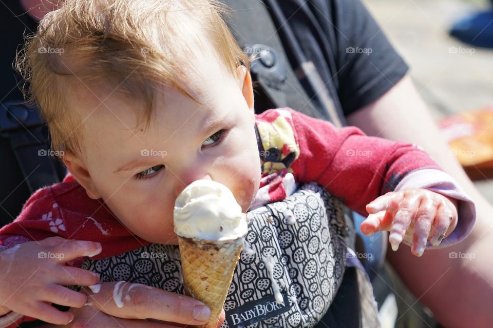 Baby Girl Eating Vanilla Ice Cream
