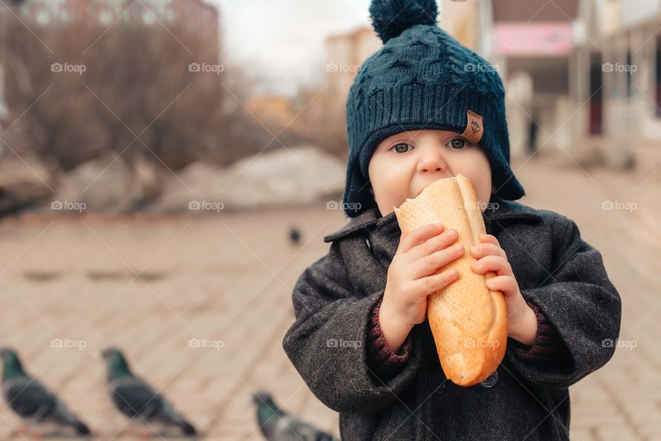 boy eating bread