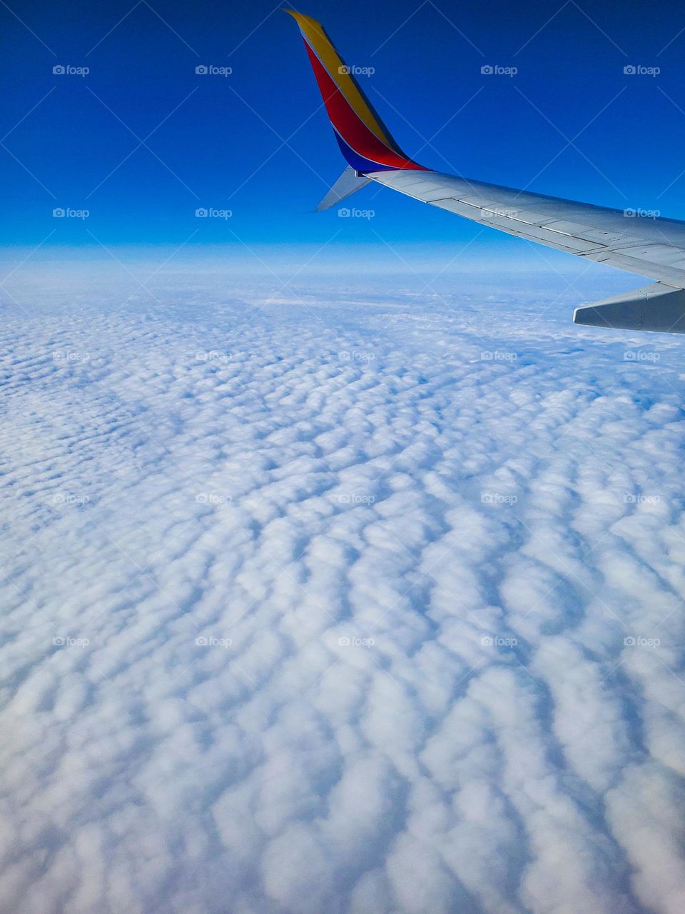 Upper level winds create a interesting cloud pattern