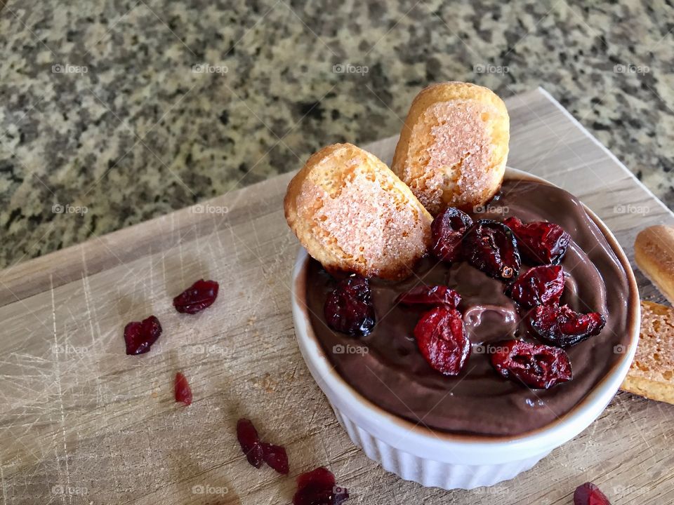 Chocolate mousse on wooden chopping board