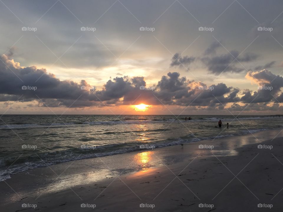 Beautiful sunset with clouds on Florida beach 