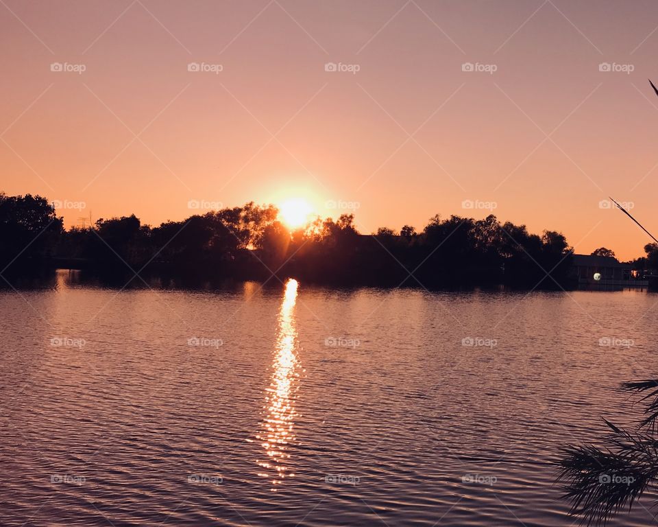 Sunset WillowLake Sun Ray streaming away from Shore. With Early Colours emitting light making a Beautiful Evening. 