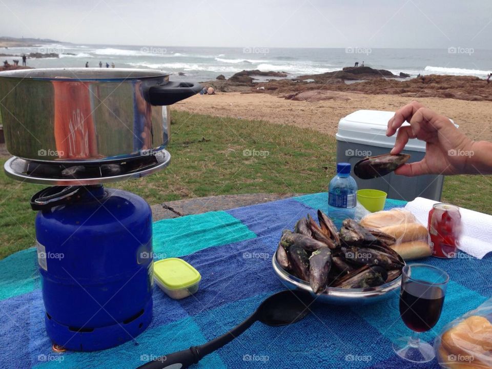 Picked fresh from the sea rocks,  straight into a pot. 
Nothing beats a fresh mussel beach picnic.
Rocky Bay 
South Africa 