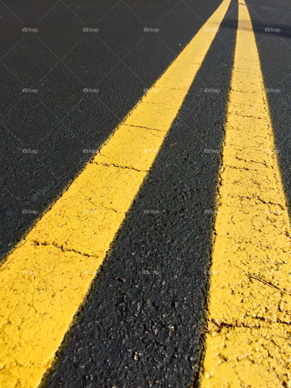 Yellow. Double yellow line on the street.