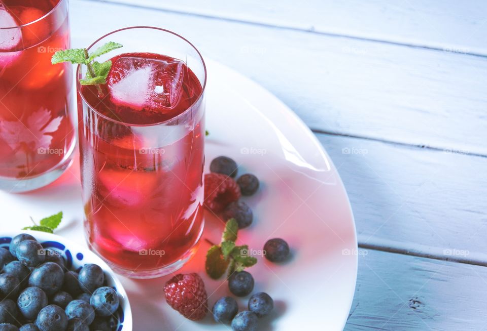 Closeup photo of glass of blueberry tea