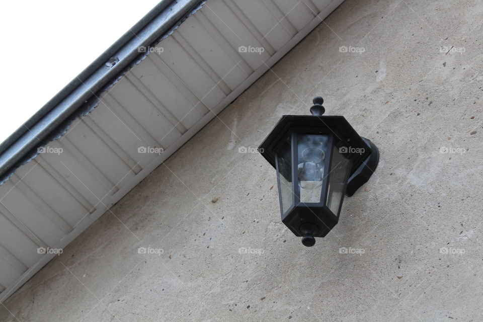 rustic lamppost on house